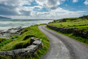 A small road in Ireland next to the ocean