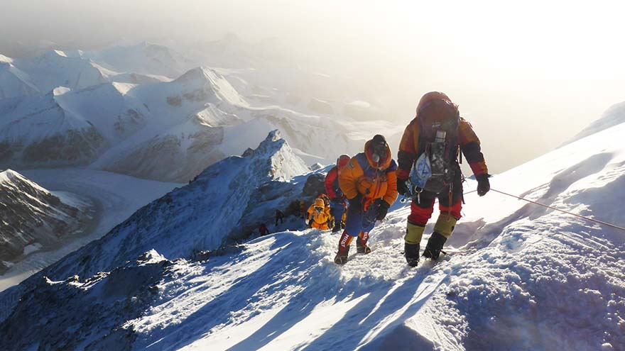 Two climbers on the side of Mount Everest, an incredibly hard mountain to climb