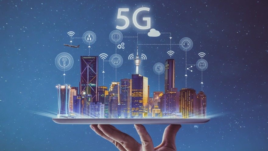 A 3D renderof a hand holding up buildings with "5G" above