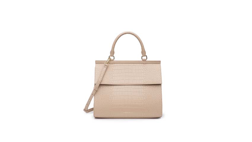 A pink faux leather lunchbox that looks like a purse for Smart Style