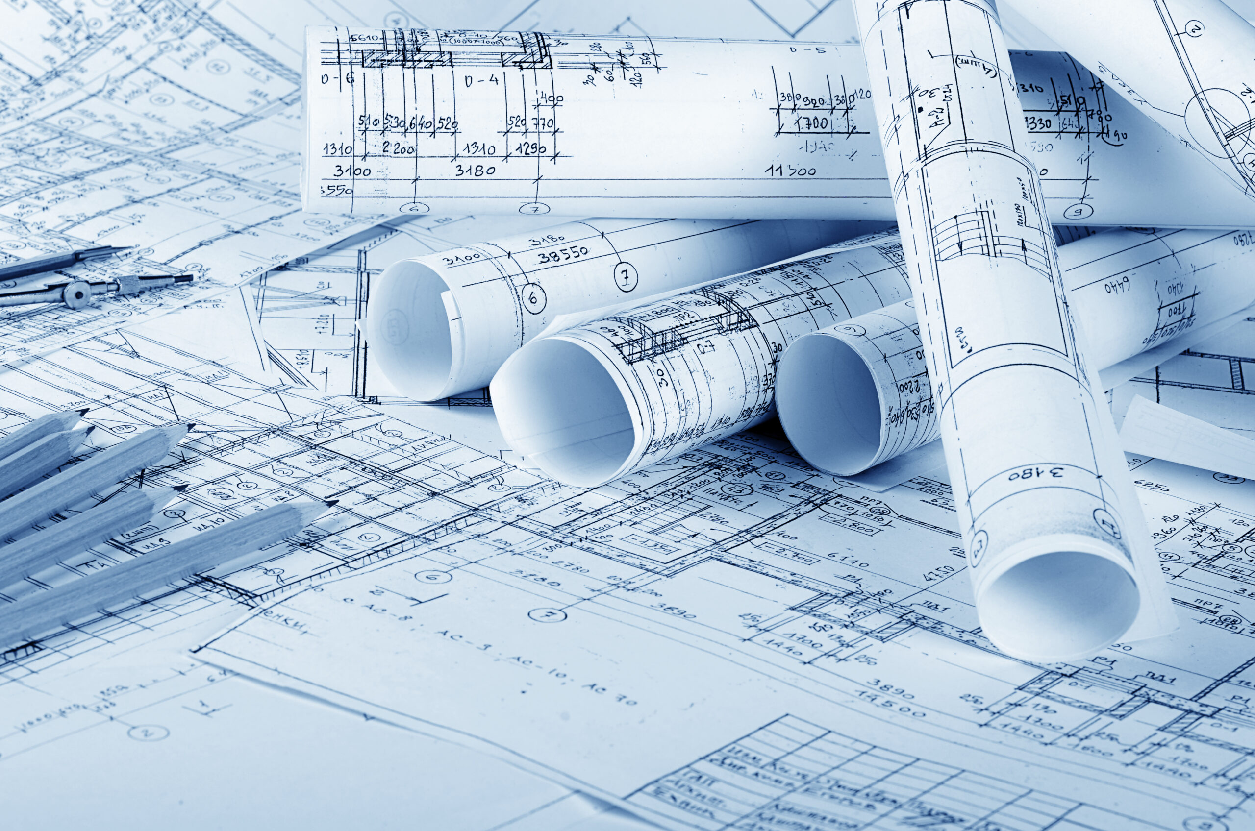 A pile of black and white house plans