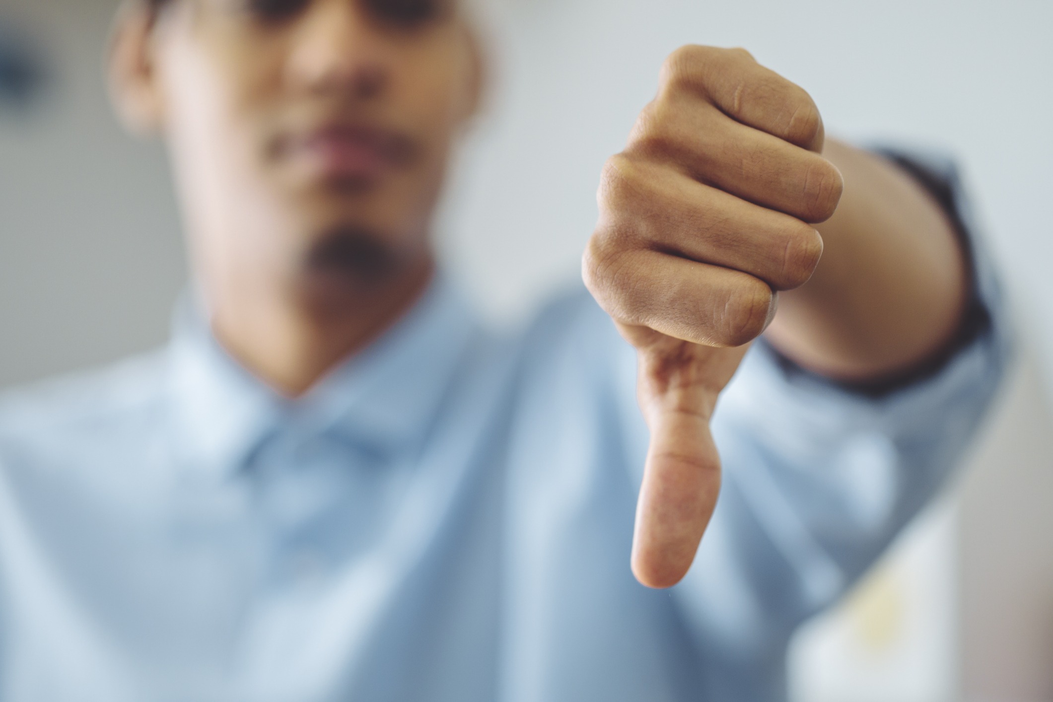 A person giving a thumbs down