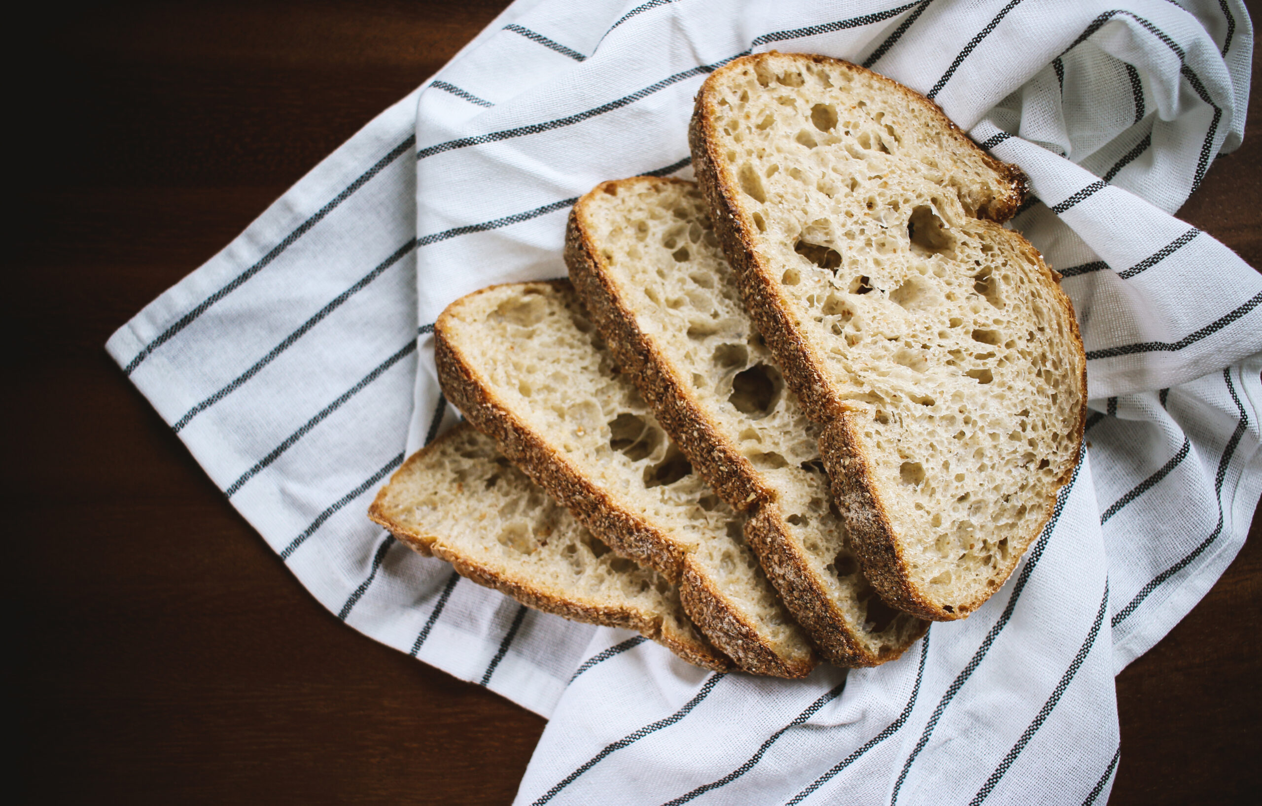 Slices of sourdough bread on a striped towel