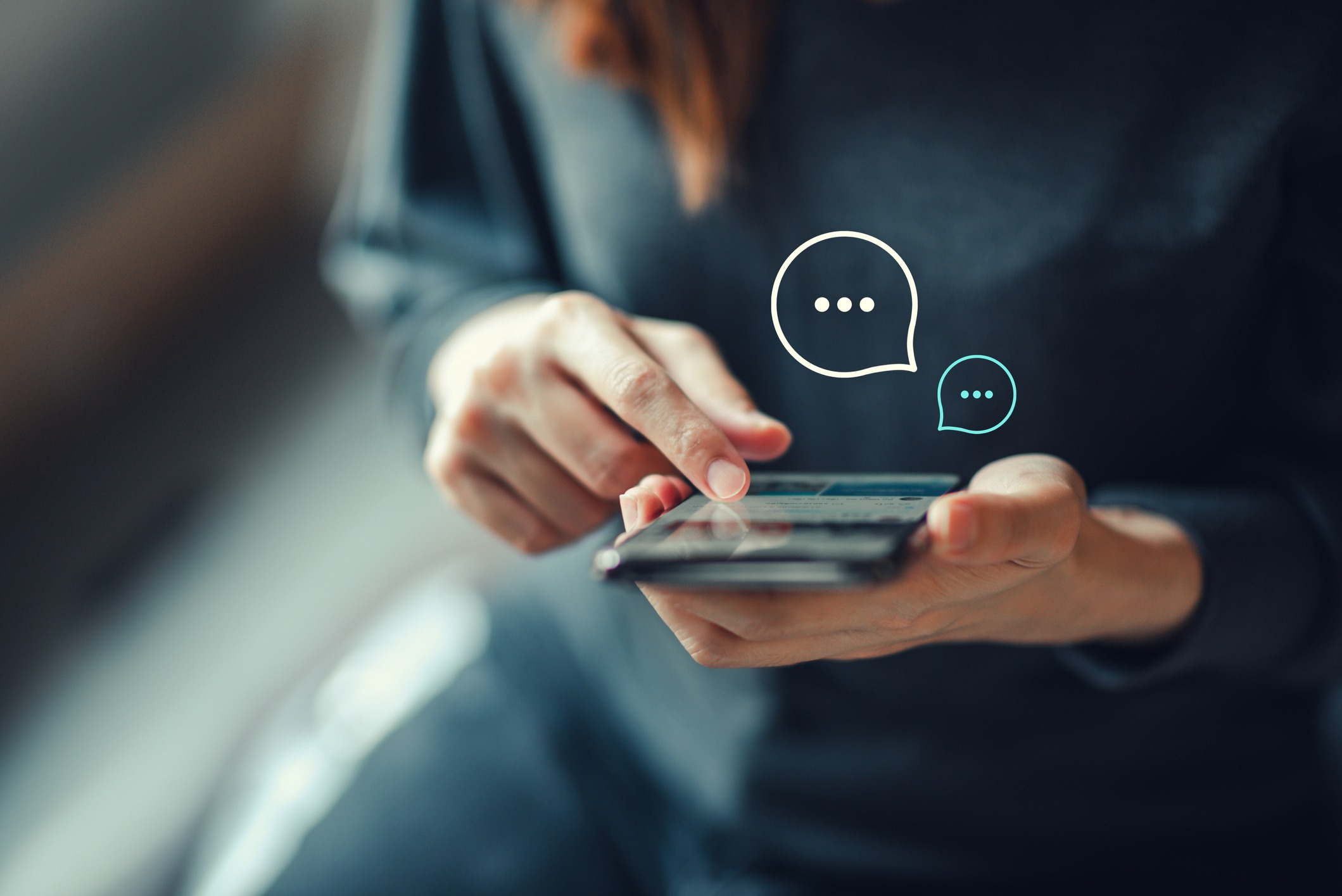 A woman scrolling on her phone.