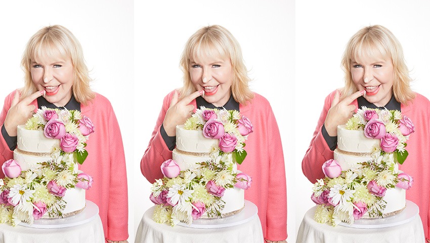 The Smart Meetings 2022 Anniversary cover, featuring founder and CEO Marin Bright and a floral tiered cake.