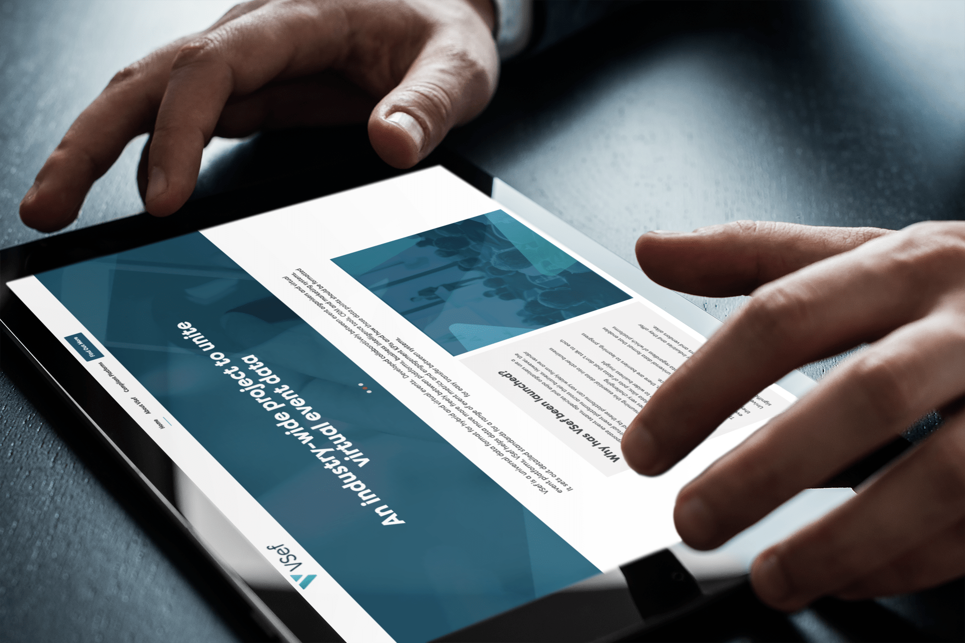 A stock image of a person looking at a website on a tablet.