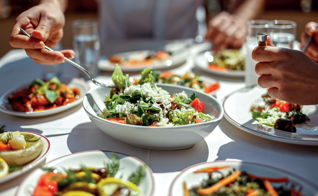 Several platters of salad, meatballs and snacks from a cruise excursion cooking lesson