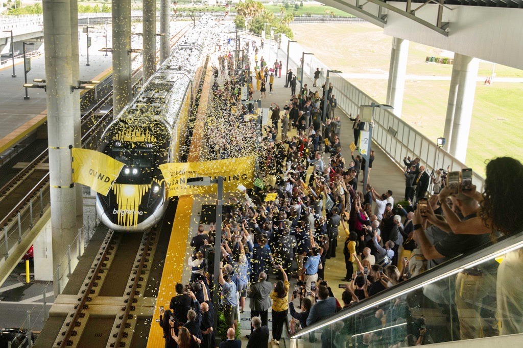 people celebrating on train station platform