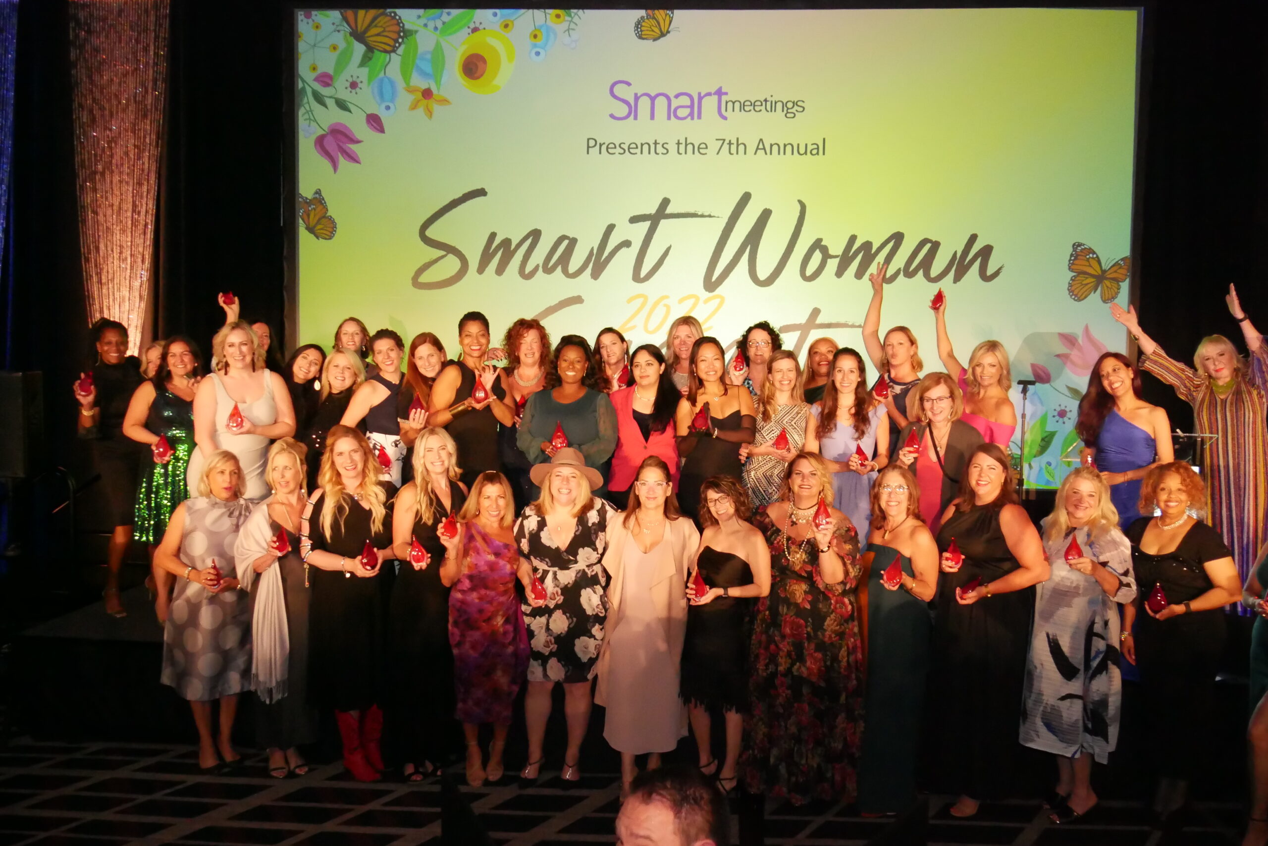 large group of women posing for picture