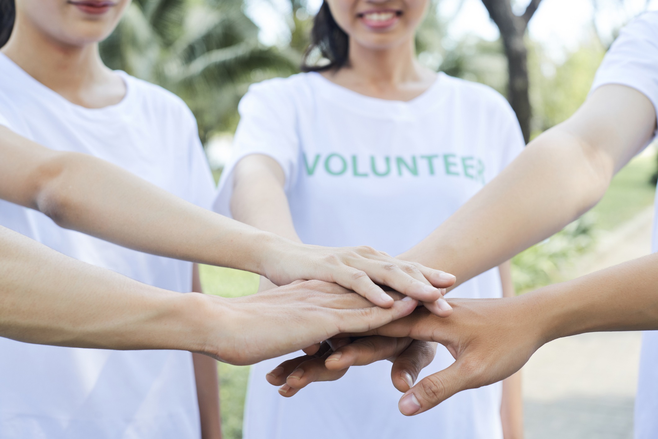volunteers stacking their hands