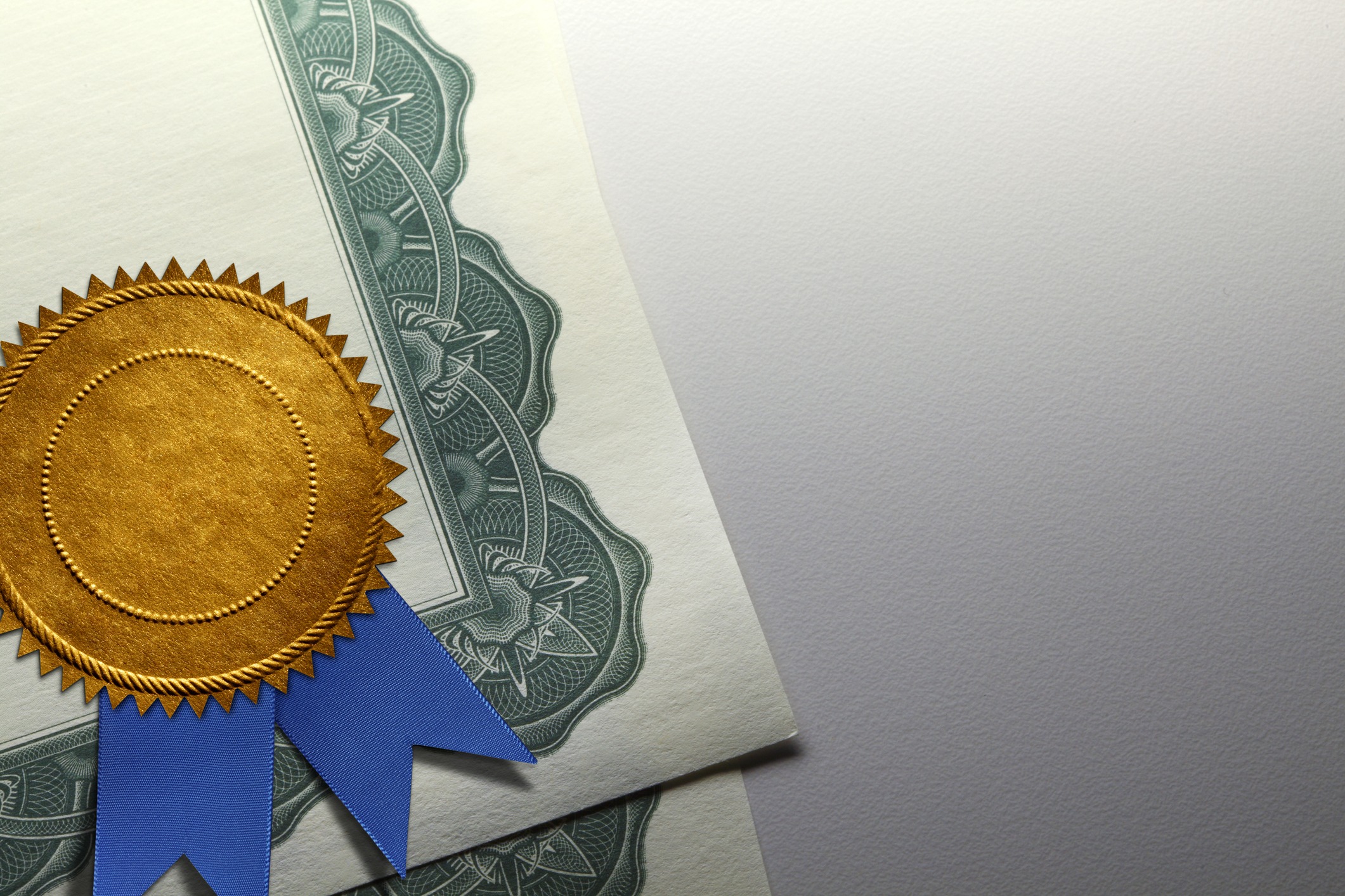 Gold Seal With Blue Ribbon On A Certificate