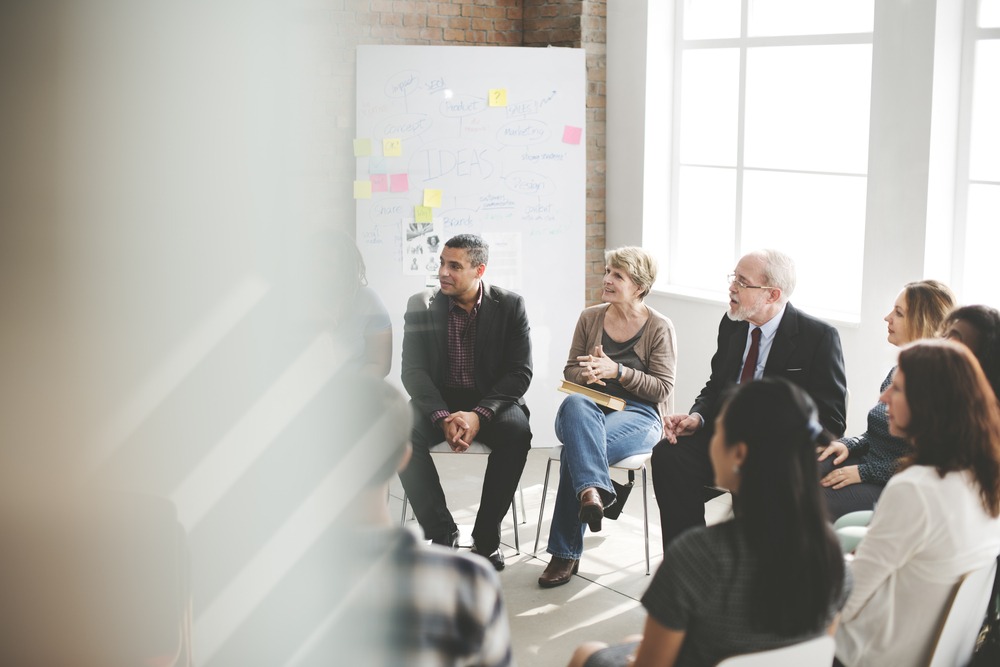 people engaged in a business meeting
