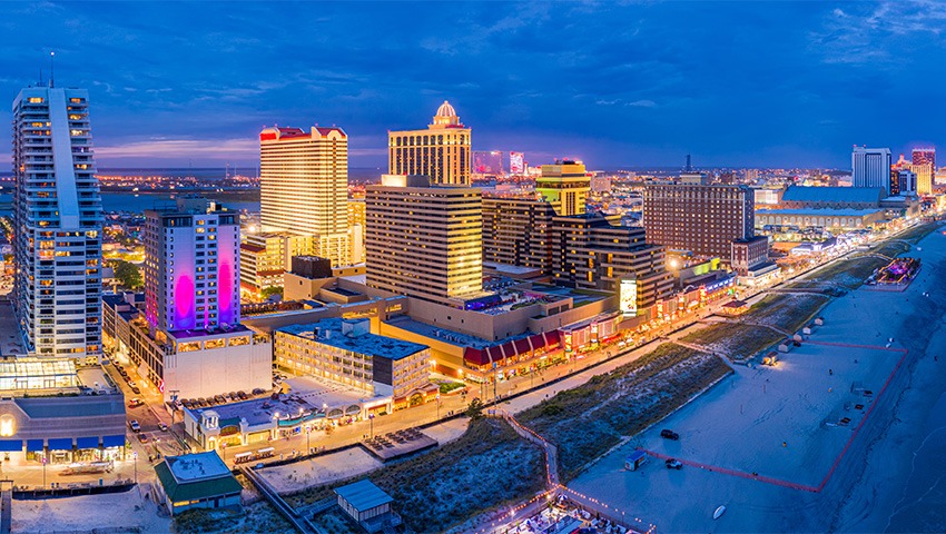 aerial shot of Atlantic city along the boardwalk at dusk