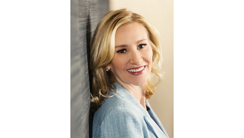 headshot of chandra allison wearing blue blazer