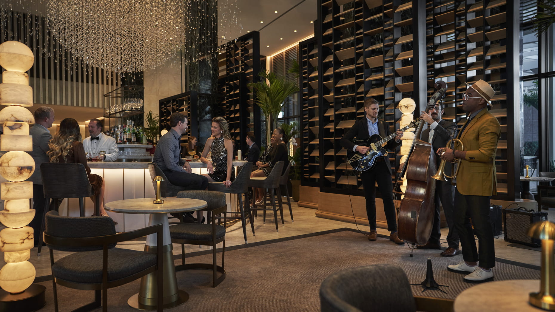 people listening to live music at Four Seasons Hotel New Orleans'Chandlier Bar