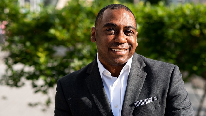 image of julius robinson wearing black sport coat and white dress shirt