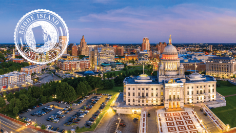 aerial view of Providence skyline and Rhode Island capitol building with white stamp of rhode island state