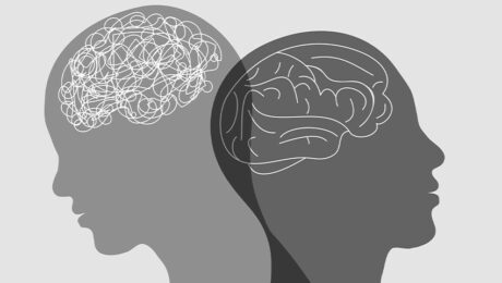 black and white illustration of two faces pointing away from each other