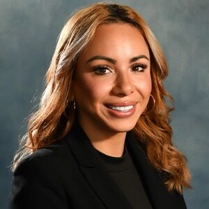 alex morales wearing black top and black blazer