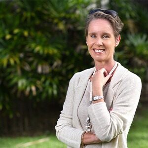 audrey huttert wearing grey monotone outfit with trees in background