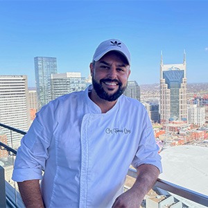 tomas diaz wearing white chef shirt