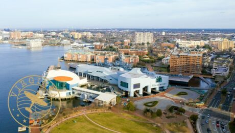 aerial view of Elizabeth River harbor and Town Point Park in the Water District of Norfolk overlayed with brown "virginia" stamp
