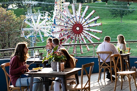 people eating in outdoor seating area