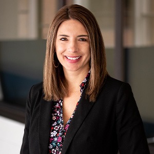 karen mcmanamon wearing colorful top and black coat