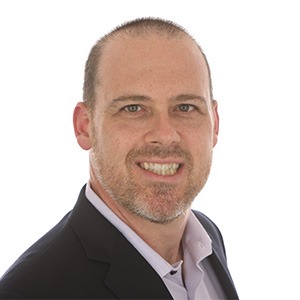 scott snofsky wearing black coat and white dress shirt