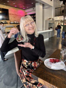 woman posting with food at Visit Myrtle Beach Meeting Planner Appreciation Day event