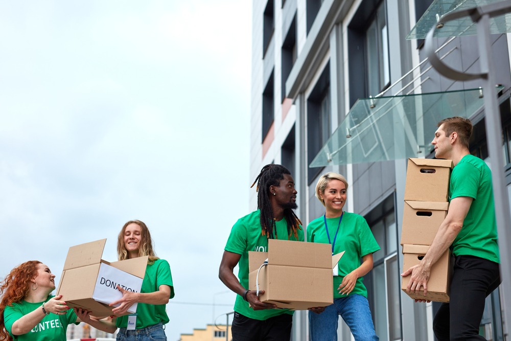 young enthusiastic volunteers with donations