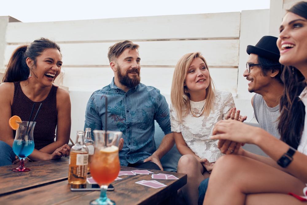 Group of friends relaxing together around a table