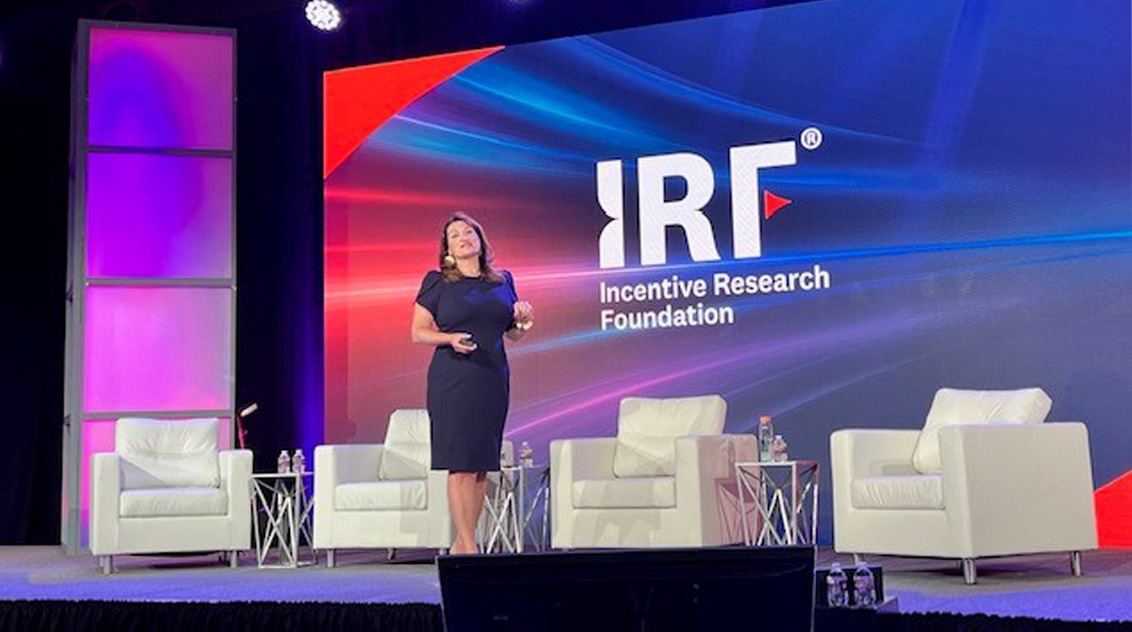 woman on stage speaking