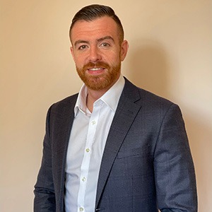 man wearing white dress shirt and blue sport coat