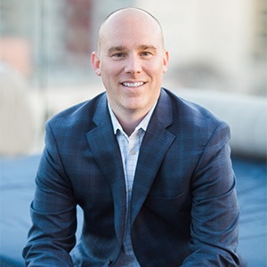 man wearing white dress shirt and blue sport coat