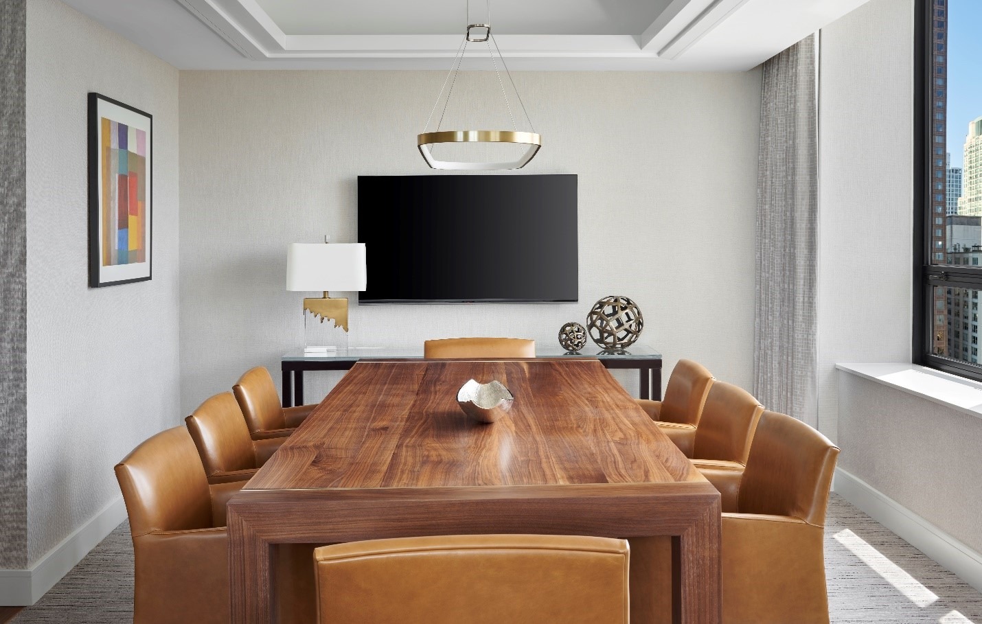 meeting room with wood grain table and chairs