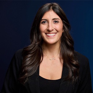 woman smiling, wearing black dress shirt
