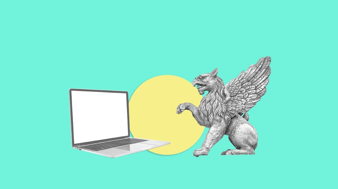 gargoyle and laptop on turquoise background