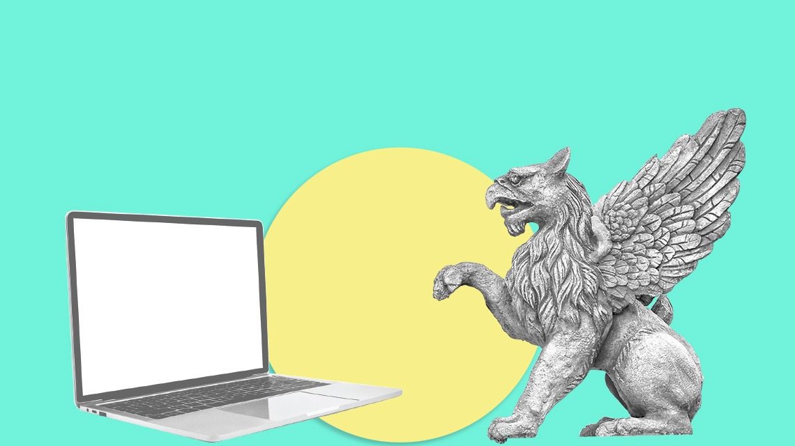 gargoyle and laptop on turquoise background