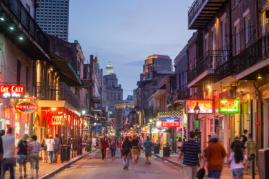 people walking around in busy alley