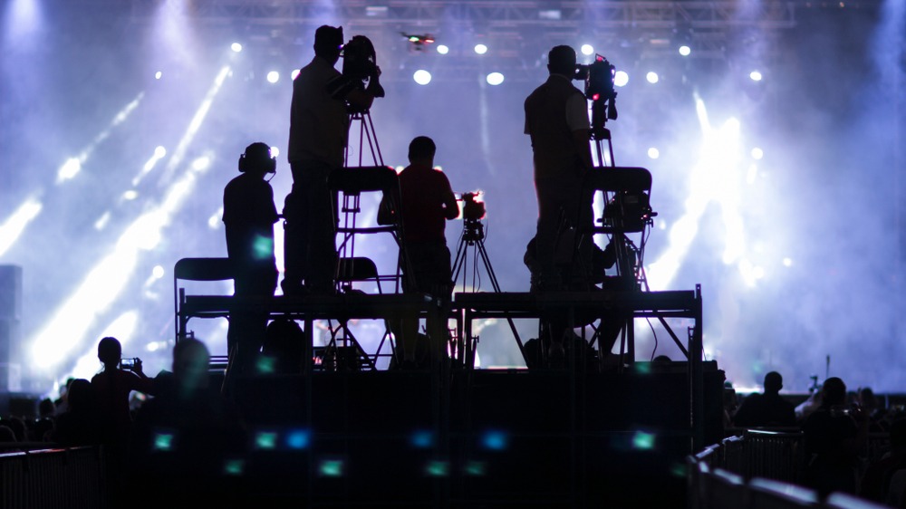 silhouette group of cameramen at an event
