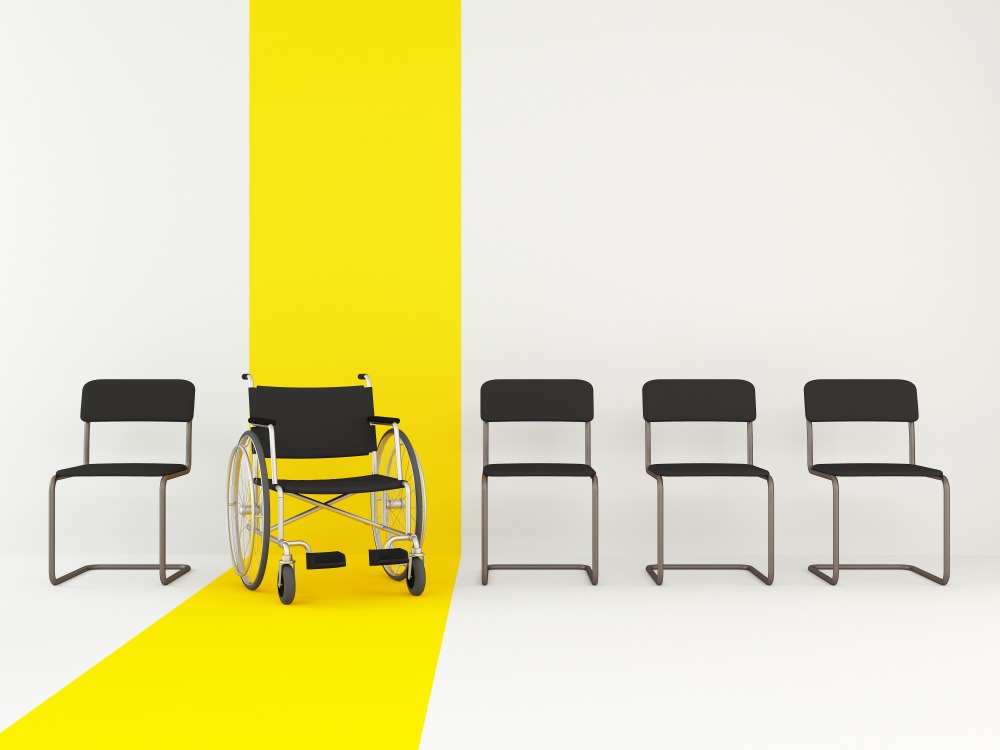 Wheelchair among office chairs