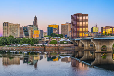 view of skyline of city from lake