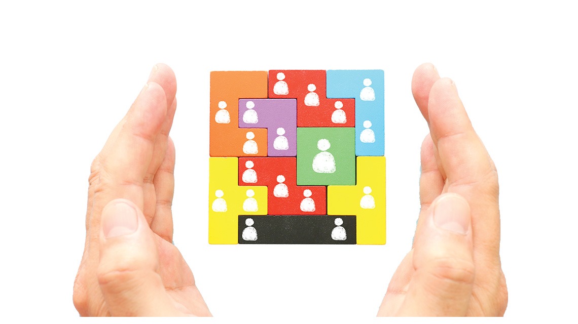 colorful puzzle floating between hands