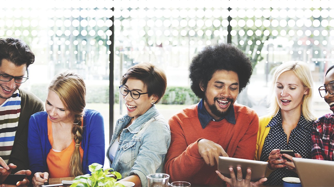 businesspeople smiling and talking to each other