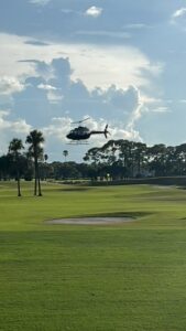 Helicopter landing on a golf course