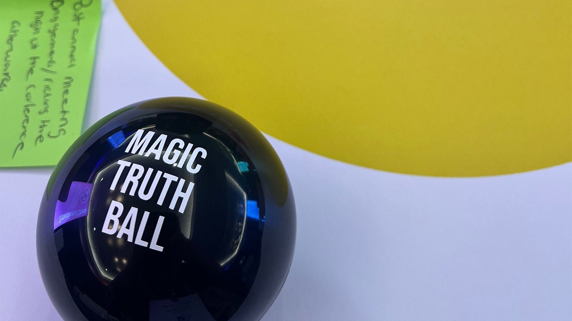 black ball that reads "magic truth ball"