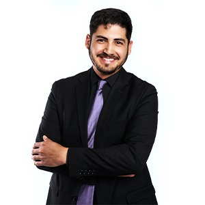 man wearing black sport coat and purple shirt