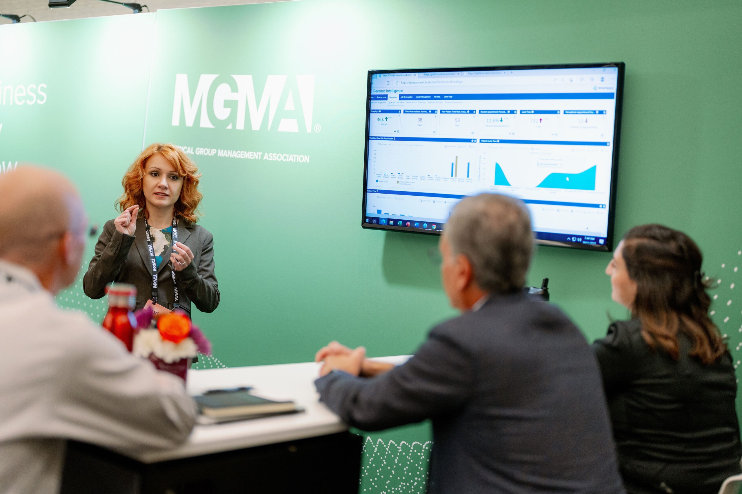 woman talking to three people