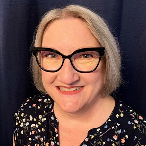 woman wearing black dress shirt with colorful polka dots